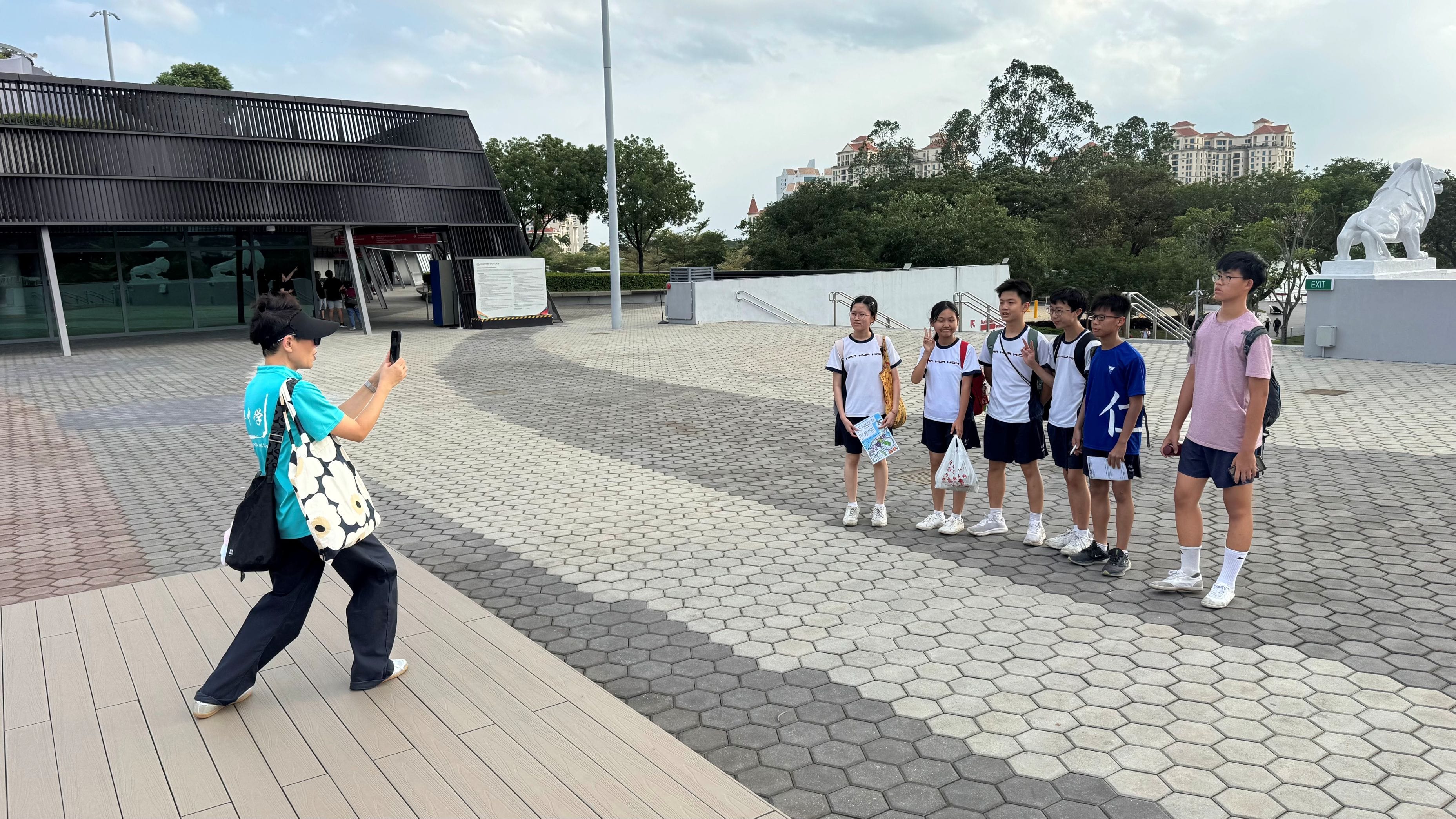 Parent taking a picture of students at Singapore Sports Hub